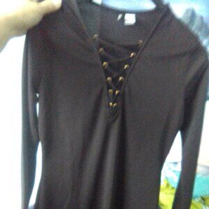 Basic black comfy black dress with flirtitious laced neckline and gorgeous hem.